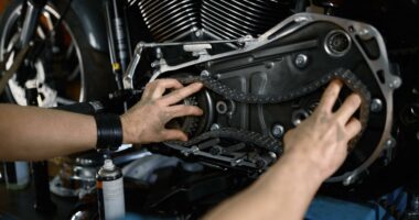 man-mechanic-fixing-motorcycle-engine-working-at-g-2023-03-31-17-35-46-utc